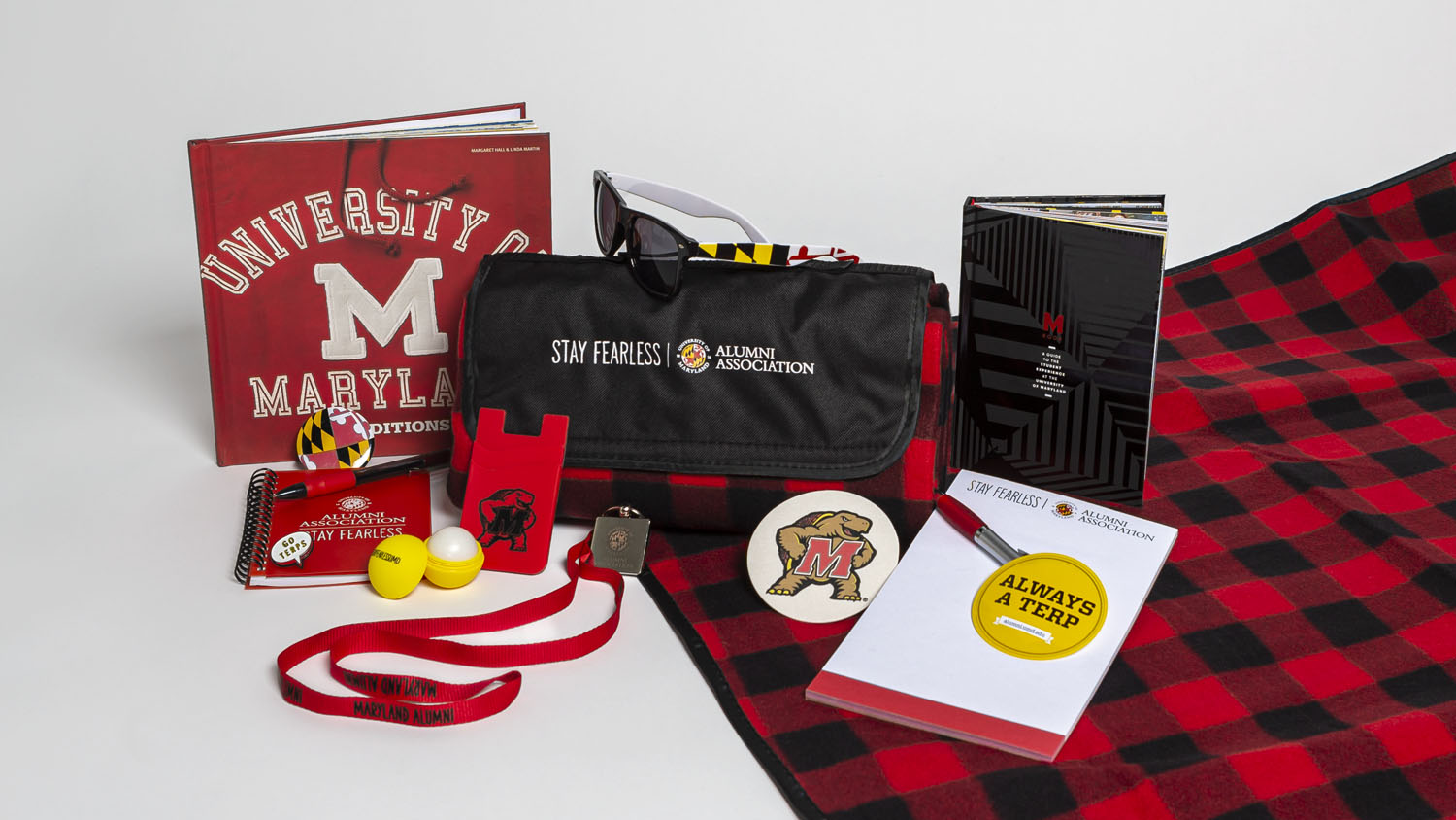 Photograph of an assortment of University of Maryland Alumni Association branded gifts and swag.