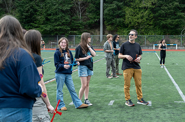 Ed Love teaches students how to throw boomerangs