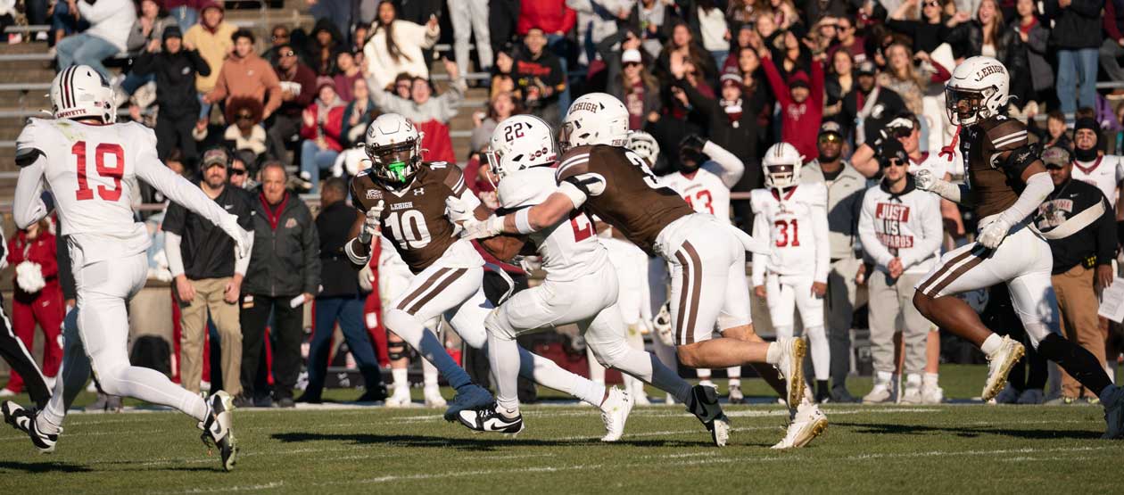 Men's football playing against Lafayette on the field