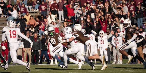 Men's football playing against Lafayette on the field Men's football playing against Lafayette on the field
