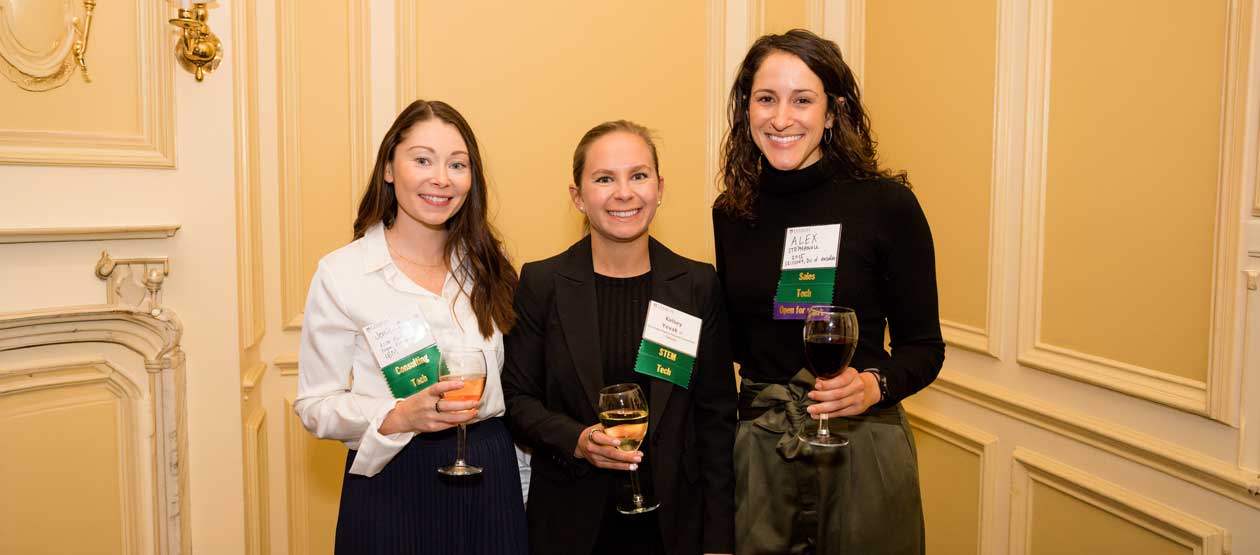 three women posing and smiling for the camera three women posing and smiling for the camera